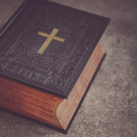 black-Bible-on-gray-surface